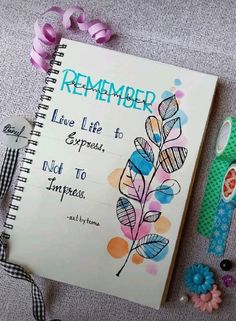 a notepad with the words, remember live life to express, and flowers next to it