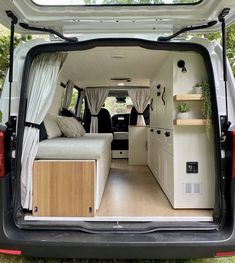 the interior of a camper van with its doors open