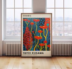 a poster on the floor in front of a window that says yayo kusama