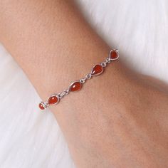 "Natural Carnelian Bracelet, 925 Sterling Silver Bracelet, Handmade Bracelet, Women Silver Jewelry, Cabochon Bracelet, Wedding Gift For Women Gemstone - Carnelian Stone Quality - AAA Weight - 4.86 gm Stone Length- 0.8 cm, Stone Width - 0.5 cm Bracelet Length - 6 inch to 9 Inch sizes are available, we give extra 0.5 inch adjustable in every bracelet. Stone Shape - As shown in the picture We serve complete 925 sterling silver Jewelry and genuine properties of the stone. The products are dispatched Elegant Carnelian Gemstone Bracelets, Elegant Round Carnelian Bracelets, Silver Carnelian Gemstone Bracelets, Adjustable Silver Carnelian Bracelets, Silver Carnelian Bracelet With Natural Stones, Silver Carnelian Gemstone Bracelet, Carnelian Bracelet Jewelry Gift, Silver Carnelian Bracelets As Gift, Silver Carnelian Bracelet As A Gift