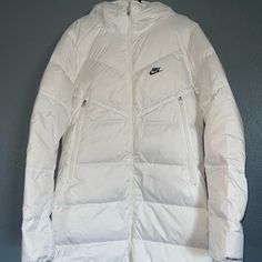 New Nike Sportswear Down-Fill Windrunner Shield Long Down Jacket White Size Small Tall White Down Puffer Jacket With Long Sleeves, White Nylon Hooded Jacket For Fall, White Down Puffer Jacket For Cold Weather, White Nylon Track Jacket For Winter, Winter Sports Long Sleeve Puffer Jacket, Sporty Fitted Outerwear For Winter Sports, White Down Puffer Outerwear, White Hooded Puffer Jacket With Pockets, Sporty Puffer Outerwear For Winter Sports