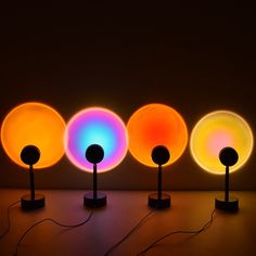 four different colored lights sitting next to each other