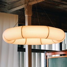 a chandelier hanging from the ceiling in a room