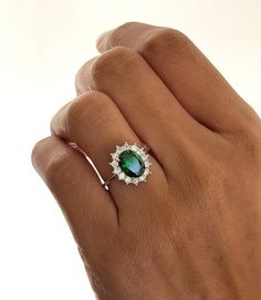 925 Sterling Silver, Emerald & CZ Diamond Ring, Victorian Vintage Statement Ring, Lab Gemstone, Handmade Engagement Ring, Emerald Ring. Manufacture Country : India * Customization always available for Ring size, metal selection and any type of center stones changes, etc.... * If you want to make your own idea of Jewelry we can do it. Material : 925 Sterling Silver Main Stone : Emerald Secondary Gemstone : CZ Diamond Gemstone Color : Green  Gemstone Shape : As Seen In A Picture Ring Size : All Size Available Weight : 12.87 gm * Shipment will dispatch within maximum 2-3 Days of Order done * Some Special customization can take more Time * UPS, DHL, FEDEX OR ARAMEX Will be available for Delivery Dazzling Silver Emerald Ring In Sterling Silver, Gift Emerald Ring With Cubic Zirconia Halo, Dazzling Gemstone Halo Ring Gift, Emerald Cut Halo Jewelry In Sterling Silver, Emerald Cut Halo Sterling Silver Jewelry, Silver Emerald Ring With Halo, Silver Emerald Ring With Halo Fine Jewelry, Dazzling Sterling Silver Halo Ring With Gemstone, Dazzling Sterling Silver Halo Ring As Gift