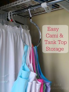 several towels are hanging on a rack in front of a shower curtain with the words easy, canni & tank top storage above them