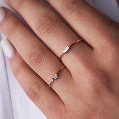 Introducing our exquisite "Light as Air" ring, where a radiant baguette diamond takes center stage. This delicate yet striking piece is perfect for everyday wear, whether worn solo or stacked with your other cherished baubles. Crafted from solid 14K gold and featuring a pristine white diamond baguette (2mm x 3mm), this ring is designed to float effortlessly on your finger. This is suitable for everyday wear. Clean with fine jewelry cleaner every few months to keep the sparkle alive.