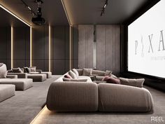 a large room with couches and a projector screen