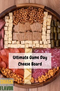 the ultimate game day cheese board is packed with meats, cheese and crackers