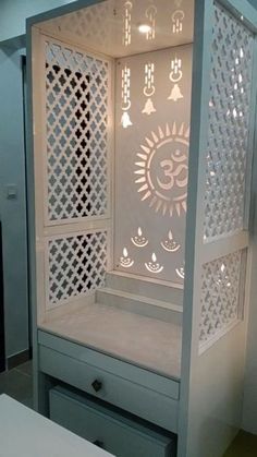 a white cabinet with an intricate design on it