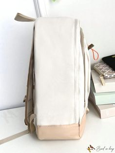 BirdinBag - Stylish Medium Backpack with Tassel Detail, Zipper Closure, and Adjustable Strap Cream Bags For Daily Use Back To School, Cream Bags For Daily Use And Back To School, Beige Bags With Zipper Closure For Back To School, Beige Backpack Laptop Bag For School, White Laptop Bag With Adjustable Strap, Beige Laptop Backpack For School, Cream Rectangular Backpack For Daily Use, Beige Travel Bags For Back To School, Beige School Backpack With Removable Pouch