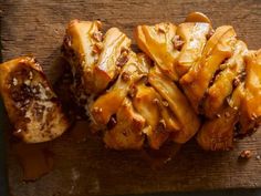 some food is sitting on top of a cutting board and ready to be cut into pieces