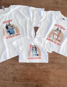 three children's t - shirts with cartoon characters printed on the front and back