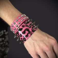 Let your rebellious side roar with this pink leopard print spiked leather bracelet. Equal parts edgy and elegant, it's the ultimate statement piece for those who crave a little anarchy in their accessories. The hot pink leopard print leather cuff exudes a fierce, don't-mess-with-me vibe. And the dangerously chic spikes add a touch of rock 'n' roll attitude. But behind the tough exterior lies a versatile stunner that can be dressed up or down. Throw it on with a vintage tee for a night of angsty Punk Bracelets, Colorful Punk, Hot Pink Accessories, Scene Accessories, Scene Jewelry, Pink Goth, Spike Bracelet, Punk Princess, Scene Outfits