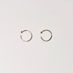 + TINY GOLD HUGGIE +TINY GOLD HUGGIE earrings made in Solid 14k Yellow Gold. Dainty open hoops with balls that hugs your ears. Shiny Yellow Gold hoops that you can wear everyday, literally. An everyday staple and heirloom. Perfect for your earlobes, cartilage or tragus. Wear 1 or a pair.+ 14ky Gold huggie hoops+ Sold as 1 single or pair + 2mm ball+ Please allow 3-5 business days to ship out. Minimalist Recycled Gold Huggie Earrings, Minimalist 14k Rose Gold Huggie Earrings, Minimalist 14k Gold Huggie Ear Cuff, Minimalist 14k Gold Huggie Earrings, Everyday Minimalist 14k Gold Ear Cuff, Tiny 14k Gold Huggie Cartilage Earrings, Minimalist Small Hoop Ear Cuff, Tarnish Resistant, Tiny Gold Minimalist Huggie Earrings, Minimalist Yellow Gold Cartilage Earrings For Everyday