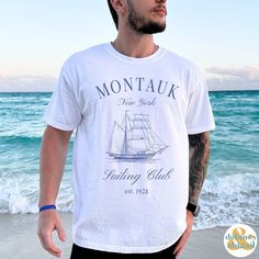 Get ready to be OBSESSED with your new Montauk Sailing Club Tee. It's the cutest and most trendy way to emit all those important Old Money Aesthetics vibes! This is the perfect Social/Sailing Club Shirt! Great as a gift for all the Boating and Sailing lovers out there! Comfort Colors introduces the soft-washed, 100% ring-spun cotton, garment-dyed fabric that brings extra coziness to your wardrobe while the relaxed fit makes it an excellent daily choice. The double-needle stitching throughout the tee makes it highly durable while the lack of side-seams helps the shirt retain its tubular shape.  ❤ The Comfort Colors 1717 tee is made with medium fabric (6.1 oz/yd² (206.8 g/m      consisting of high quality, 100% ring-spun US cotton for long-lasting comfort. ❤ The relaxed fit keeps the wearer Nautical Cotton T-shirt For Sailing, Casual Cotton T-shirt For Sailing, White Nautical Short Sleeve Tops, White Nautical Tops For Vacation, Summer Sailor Style Short Sleeve Tops, White Nautical Style Short Sleeve T-shirt, White Nautical Short Sleeve T-shirt, Nautical Short Sleeve Beach Top, White Short Sleeve Nautical T-shirt