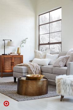 a living room filled with furniture and a large window covered in snowflakes