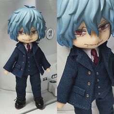 two pictures of a doll with blue hair in a suit and tie, standing next to a sink