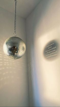 a disco ball hanging from a ceiling in a room