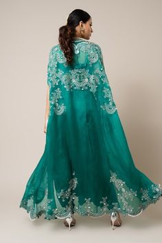 Sea green organza shoulder-gathered cape with mirror, swarovski, metallic sequins, studs and pearls hand embroidery. Comes with a satin knotted skirt and a crepe scallop blouse. - Aza Fashions Green Wedding Dupatta With Cape Sleeves, Green Evening Dupatta, Organza Cape Dress For Wedding, Party Organza Dupatta With Cape Sleeves, Organza Dupatta With Cape Sleeves For Party, Festive Evening Dupatta In Cape Style, Cape-shaped Dupatta For Wedding, Evening Festive Cape Dupatta, Festive Evening Cape-style Dupatta