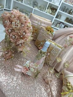 a table topped with lots of pink and gold items