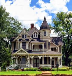 an old victorian style house in the country