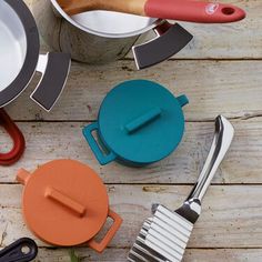 various kitchen utensils on a wooden table