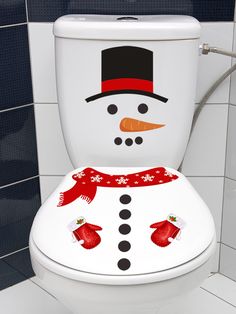 a toilet with a snowman painted on it