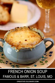 the cover of french onion soup from famous & bar is shown next to a glass of wine