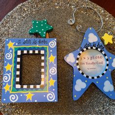 there are two decorated items on the trays, one is a photo frame and the other is a star ornament