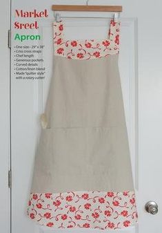 an apron hanging on a door with the words market street apron written in red and white