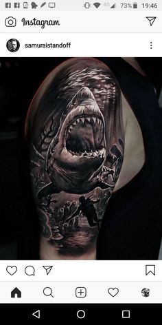 a man with a shark tattoo on his arm