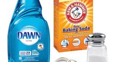 a bottle of dawn baking soda next to a container of baking soda and other items