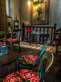 colorful chairs and tables in a small room