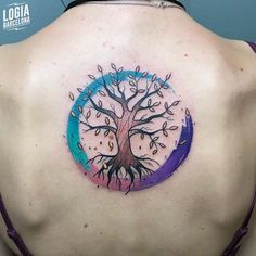 a woman with a tree tattoo on her back