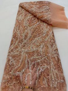 This high quality Fabric is measured in 5 Yards With Embroidered Beading and Sequin. It is soft, very delicate and beautiful. This high Quality Fabric is made with Fashion embroidered rhinestones can be used in making party wedding dresses, skirts, shawls, scarves and other other fashion apparels as you would like. Size : Length : 5 yards (180 inch). Width: 50 inch (Please allow slight deviation for the measurement data ,±1 inch) Material: 100% Polyester, Tulle Lace Fabric, Eco-Friendly embroide Elegant Beige Tulle Fabric For Party, Elegant Embroidered Fabric With Rhinestones For Party, Elegant Beaded Tulle Fabric, Elegant Fitted Beaded Tulle Fabric, Elegant Embellished Fitted Tulle Fabric, Elegant Fitted Sequin Organza Fabric, Elegant Rhinestone Embroidered Fabric For Banquet, Elegant Tulle Lace Fabric With Rhinestones, Gold Sequin Fabric With Rhinestones For Wedding