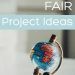 a hand holding a globe with the words fair project ideas written on it in white