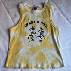 Grateful Dead Yellow Tie Dye Tank. Size Youth Large/ Women’s Small. Never Worn. Please Leave A Comment Below If You Have Any Questions Or Comments, Thank You! I Also Have Lots Of Other Super Cute Listings To Check Out! Offers Welcome And Encouraged! Fun Yellow Sleeveless Top, Cute Yellow Sleeveless Top, Fun Yellow Tops For Fall, Yellow Sleeveless Top For Fall, Fun Yellow Fall Tops, Cute Yellow Summer Tops, Cute Stretch Yellow Tops, Casual Yellow Tank Top With Graphic Print, Cute Yellow Stretch Tops