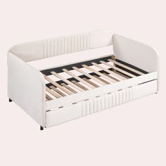 a white bed frame with wooden slats on the bottom and foot board, in front of a white background