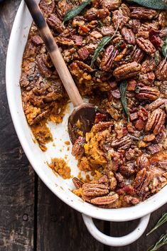 a casserole dish filled with pecans and sage