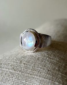 Beautiful moonstone ring in a modern design. The ring band is brushed, which makes it look particularly elegant and fine. It is also very stable, as it is about 2 mm thick, which is not the case with many other stone rings. Depending on the incidence of light, the moonstone appears in various facets with a blue shimmer. Depending on the light, different colors may appear, and the shimmer of moonstone and labradorite stones (rainbow moonstone) is completely individual - that is exactly what makes Ring Moon, Modern Ring, Labradorite Stone, Moonstone Ring, Ring Band, Moon Stone, Rainbow Moonstone, Rings Statement, 925 Sterling Silver Ring