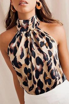 Stunning statement animal print halter neck top. Gorgeous teamed with denim or tailoring for day or night. Sleeveless, halter style top. POLYESTER Mode Prints, Leopard Print Fashion, Halter Blouse, White Shirt Blouse, Leopard Blouse, Leopard Fashion, Leopard Print Blouse, Womens Tops Summer, Sleeveless Tshirt