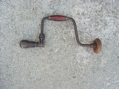 an old pipe laying on the ground with it's end connected to another pipe