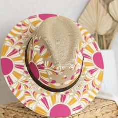 This Victoria Artisanal Hat is crafted with care by Alicia in Oaxaca, Mexico. Its distinctive, hand-painted design stands out with vibrant colors and fun patterns, creating a stylish and versatile accessory suitable for any season. Traditional Mexican aesthetics get a modern twist in this beautiful, curated selection of hats. Size: Medium 22.8 inches. One size fit most; hat features an internal elastic band for comfort. Materials: Painted jute. The hat brim features a leather band, and colors of Multicolor Wide Brim Panama Hat In Toquilla Straw, Multicolor Toquilla Straw Hat With Curved Brim, Handmade Multicolor Straw Hat For Spring, Multicolor Hand Painted Hat With Curved Brim, Multicolor Fedora Hat In Toquilla Straw, Multicolor Summer Fedora With Curved Brim, Artisan Multicolor Fedora Straw Hat, Multicolor Toquilla Straw Fedora Hat, Summer Multicolor Fedora With Curved Brim