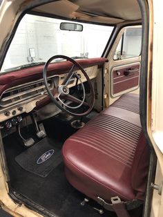 the interior of an old car with leather seats