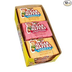 three sugar wafers are in a box on a white background with the words sugar wafers vanilla