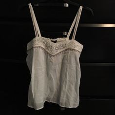 American Eagle Flowy Top. White Size Small But Fits More Like A Medium. New With Tags. Casual Cream Camisole For The Beach, White Cotton Camisole For Vacation, Casual White Camisole For Daywear, White Lace Trim Camisole Casual Style, White Bohemian Cotton Camisole, White Lace Trim Casual Camisole, Thrift Finds Clothes, Cowgirl Brandy Melville Top, Brandy Melville Angel Top