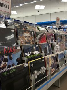 rows of vinyl records on display in a store