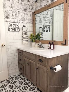 a bathroom with a large mirror above the sink