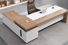 an office desk with a laptop on it