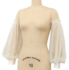 a white mannequin with sheer sleeves and an inscription on the front that reads,'curvyble shoulder 10 '